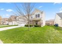Two-story home with an attached garage and green lawn at 15144 Dry Creek Rd, Noblesville, IN 46060
