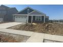 Inviting single-story home featuring a covered front porch, attached garage, and clean concrete driveway at 1644 Winn Ct, Fortville, IN 46040