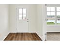 Bright entryway featuring wood-look flooring, a glass door, and views to a window at 2764 Glade Ave, Plainfield, IN 46168
