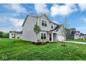 Beautiful single-Gathering home with a manicured lawn, young trees, and gray siding at 2764 Glade Ave, Plainfield, IN 46168