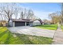 Attractive home featuring a long driveway and fresh landscaping, perfect for suburban living at 2815 Kay Ellen Dr, Indianapolis, IN 46229