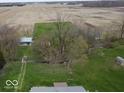Picturesque countryside property with a lovely creek, verdant lawns, and a cozy home nestled among mature trees at 3335 W 400 N, Anderson, IN 46011