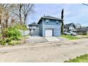 Detached garage, offering convenient parking and additional storage space, with driveway at 3516 N Capitol Ave, Indianapolis, IN 46208