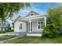 Inviting two-story home with a classic design and a cozy front porch at 3902 N Capitol Ave, Indianapolis, IN 46208