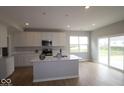 Contemporary kitchen featuring an island with a sink and stainless steel appliances at 4152 Dutton Dr, Bargersville, IN 46106