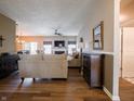 Spacious living room featuring hardwood floors, a fireplace, and an open layout at 4631 Belair Cir, Plainfield, IN 46168