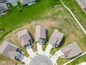 Overhead view of homes arranged in a circular cul-de-sac at 5218 Triple Crown Way, Indianapolis, IN 46237