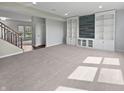Spacious living room featuring custom built-in shelving at 6234 N Woods Edge Dr, McCordsville, IN 46055