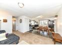 Spacious living room features carpet and hardwood flooring with a view to the dining area at 664 N County Road 800 E, Avon, IN 46123