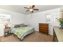 Bright main bedroom featuring neutral tones, ceiling fan and a cozy bed at 664 N County Road 800 E, Avon, IN 46123