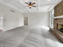 Open living room with neutral paint, plush carpet, fireplace, and plenty of room to relax at 6915 Juliet Dr, Avon, IN 46123