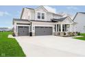 Attractive two-story home with a three-car garage and a wide driveway at 7158 Sugar Maple Ln, Brownsburg, IN 46112