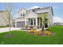 Charming two-story home with gray siding, well-kept lawn, and lovely curb appeal at 7158 Sugar Maple Ln, Brownsburg, IN 46112