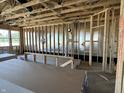 Living room with a wall of windows, framed walls, and a stylish ceiling, offering abundant natural light at 778 Oakleaf Dr, Greenfield, IN 46140
