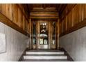 Elegant entryway showcasing detailed woodwork, marble walls, and an ornate glass door with vintage charm and character at 801 N Pennsylvania St # Apt D, Indianapolis, IN 46204