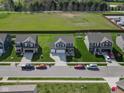 Aerial view showcases a well-planned neighborhood with manicured lawns, modern homes, and ample green space in a suburban setting at 8442 Averly Park Dr, Indianapolis, IN 46237