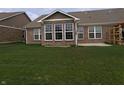 A spacious backyard features a patio and a pergola at 8801 Twain Ln, Indianapolis, IN 46239