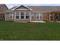 A spacious backyard features a patio and a pergola at 8801 Twain Ln, Indianapolis, IN 46239