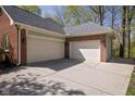Spacious three-car garage with a concrete driveway providing ample parking and storage space at 9838 Gulfstream Ct, Fishers, IN 46037