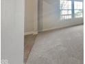 Neutral carpet with a view of a window and light at 10689 Brooks St, Indianapolis, IN 46234