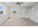 Bright living room featuring sleek, light-colored floors, and large windows at 1409 S Kiel Ave, Indianapolis, IN 46241