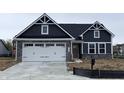 Charming home with a two-car garage, stone accents, and a modern design at 5125 Gerhing Dr, Indianapolis, IN 46239