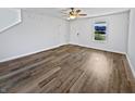 Spacious living room showcasing hardwood floors, ample natural light, and a fresh, neutral color scheme at 15507 Dry Creek Rd, Noblesville, IN 46060