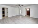 Bright living room showcasing new floors, white walls, and classic archway at 2009 N Bosart Ave, Indianapolis, IN 46218