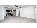 Open concept living space with stainless steel appliances and modern finishes at 2009 N Bosart Ave, Indianapolis, IN 46218