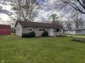 Inviting single-story home featuring a well-manicured lawn and bright white front door at 212 Mooreland Dr, Whiteland, IN 46184