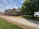 Rear view of property showing detached garage and driveway at 2365 E 850 N, Lebanon, IN 46052