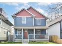 Charming two-story home features a welcoming front porch and a beautifully painted exterior at 2945 N New Jersey St, Indianapolis, IN 46205