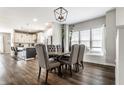 Elegant dining room with stylish light fixture and a window seat that provides natural light at 3133 Ruckle St, Indianapolis, IN 46205