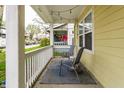 Relax on this covered porch with chairs, string lights, and a charming outdoor ambiance at 3133 Ruckle St, Indianapolis, IN 46205