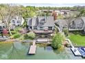 Beautiful lakeside home with a large deck, a hot tub, and a dock at 3748 Bay Rd S Dr, Indianapolis, IN 46240