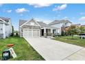 Attractive single-Gathering home with a spacious driveway, two-car garage, and well-kept lawn at 6103 Pebblebrooke Rd, Whitestown, IN 46075