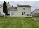 An expansive backyard showcases a deck and well-maintained lawn at 6318 Amarillo Way, Indianapolis, IN 46237