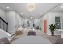 Bright, open living room with modern lighting, neutral tones and stylish furnishings at 838 N Tacoma Ave, Indianapolis, IN 46201
