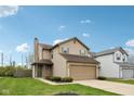 Charming two-story home features a two-car garage, green shutters, tidy landscaping and a well-maintained lawn at 10905 Amber Glow Ln, Indianapolis, IN 46229