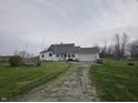 Quaint single-story home with an attached garage and large front yard at 1152 W 375 N, Anderson, IN 46011