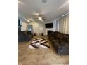 Spacious living room with a fireplace, large TV, and comfortable couches at 11726 Zander Dr, Indianapolis, IN 46235