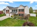 Attractive two-story home with brick and siding, a well-kept lawn, and an attached two-car garage at 1792 Salina Dr, Avon, IN 46123