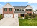 Beautiful two-story home featuring a brick and siding exterior, well-maintained lawn, and double garage at 1792 Salina Dr, Avon, IN 46123