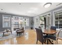 Open-concept living area with hardwood floors and french doors leading to balconies at 226 N Cleveland St # 226C, Indianapolis, IN 46204