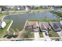 A high angle shot showcases the home's placement next to a picturesque pond within the well planned community at 2441 Longleaf Dr, Greenwood, IN 46143