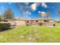 Charming single-story home with stone and siding exterior at 3303 Busy Bee Ln, Indianapolis, IN 46227