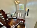 Bright foyer featuring hardwood floors, a chandelier, and a large window providing ample natural light at 3389 Grant Ct, Columbus, IN 47203