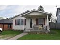 Inviting home featuring a covered front porch, ideal for unwinding outdoors at 419 W Osage St, Greenfield, IN 46140
