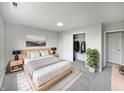 Main bedroom featuring a closet with hanging clothes, soft carpet, and a clean aesthetic at 491 Westview Dr, Bargersville, IN 46106