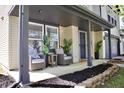 Charming covered front porch with seating area, offering a cozy spot to relax and enjoy the outdoors at 5236 Skipping Stone Dr, Indianapolis, IN 46237